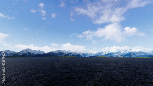 Fotografia Vast, cracked desert landscape stretches towards distant snow capped mountains u