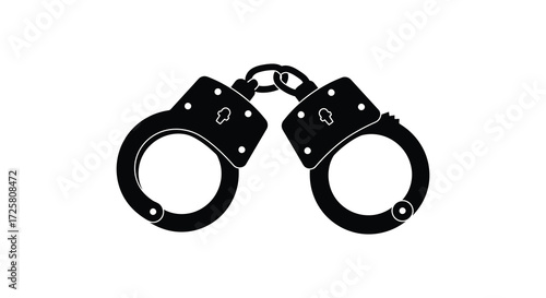 Black metal handcuffs displayed against a white background a stark silhouette