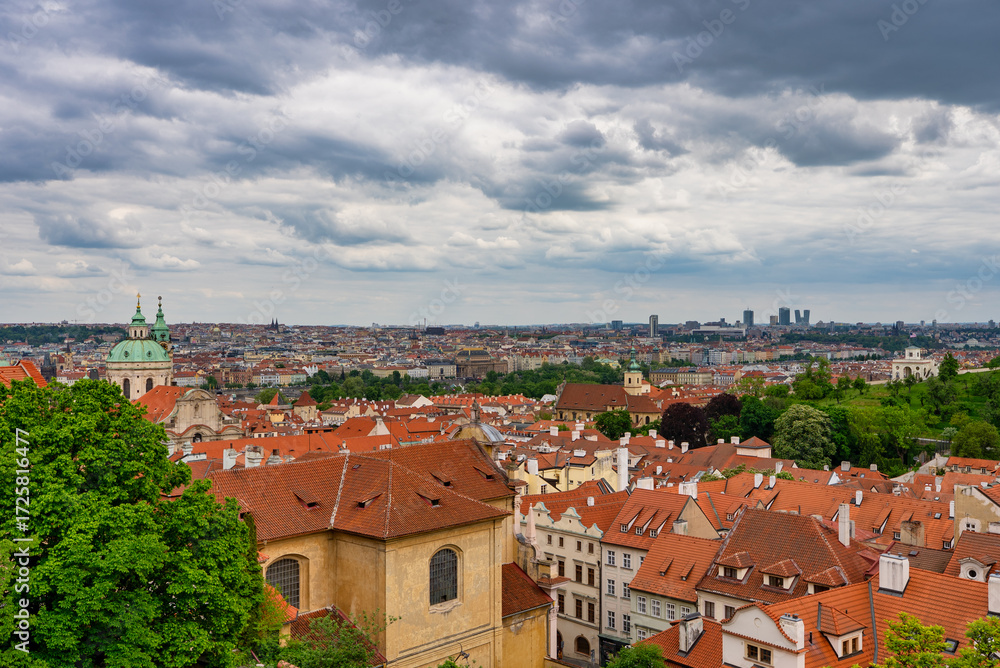 Fototapeta premium Summer cityscape of Prague with red rooftops.