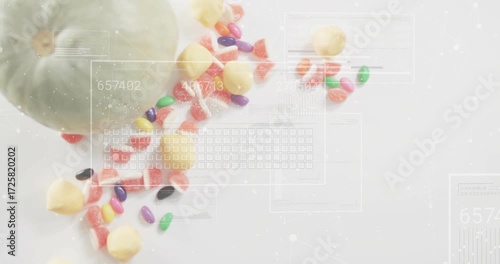 Digital overlays fading in over melon with candy, cycling numbers and sliding keys visualizing data