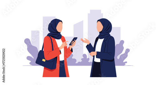 Two women in hijabs are talking about something on a smartphone.
