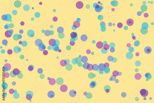 Soft pastel colored circles scattered on a pale yellow background abstract