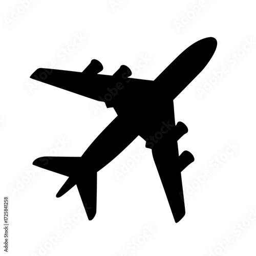 Silhouette of a large passenger plane with four engines against white backdrop