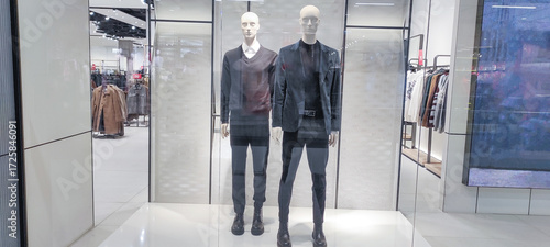 Men's fashion mannequins in a modern store. Two male dolls dressed in stylish smart-casual clothing. Dummies on a clean minimalist background.