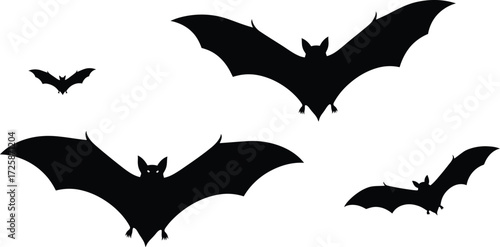 Four black silhouettes of flying bats against a plain white background.