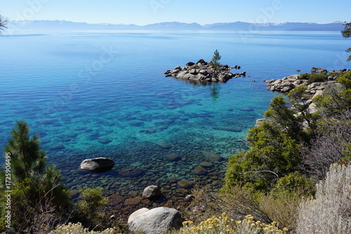 panoramic view of clear water, rocks and sand in beautiful lake Tahoe, Ca, USA, on a sunny day near Sand harbor