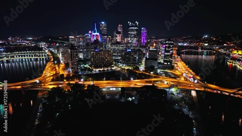 Wallpaper Mural The city of pittsburgh glows brightly at night with lights reflecting in the river Torontodigital.ca