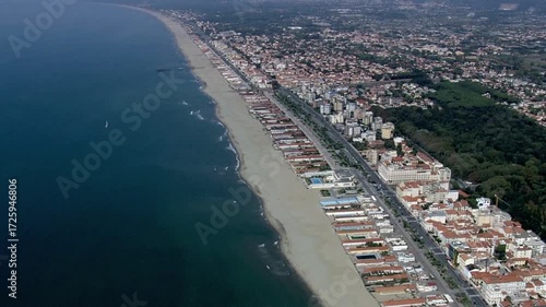 Aerial view captures the coastline of viareggio, italy, with its sandy beach