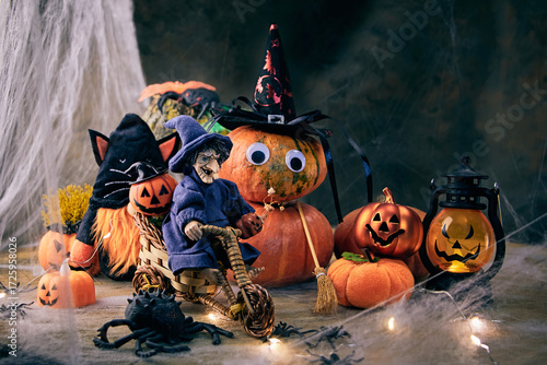 a cheerful witch arrived on a bicycle to a Halloween party with a gnome in a black cat costume, pumpkins and spiders on the eve of All Saints Day, creative focus