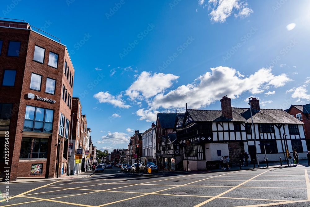 Fototapeta premium Chester, England, United Kingdom - September 21, 2025 - Downtown Chester in the Cheshire region of England as seen from the area near the city walls and the Roman Ruins. The area features Roman Ruins