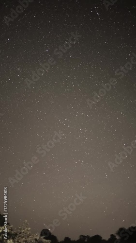 Starry night sky with milky way and meteor shower