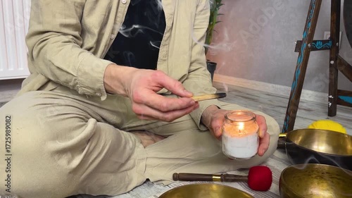 Man lighting incense for meditation and spiritual practice