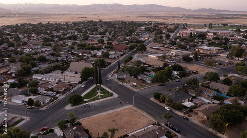 Coalinga, California, Mexico - September 2, 2024: Twilight evening traffic passes through the residential neighborhood district.