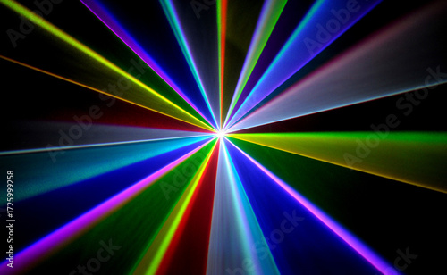 Real laser lights with colorful beams in smoke on black background – concert and party concept