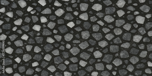 Black and white granite stone wall texture with a rough, abstract pattern