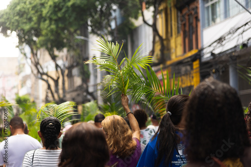 Fototapeta Hundreds of Catholics are seen walking during a Palm Sunday procession in the city of Salvador, Brazil