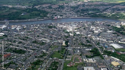 Aerial view captures the cityscape of derry, northern ireland, along the river foyle
