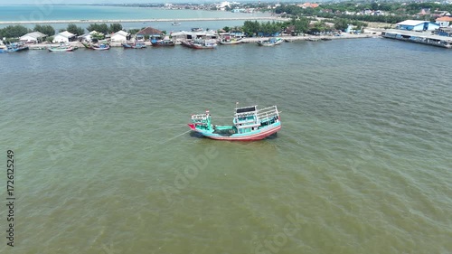 Aerial View of Fishing Boat in Tranquil Coastal Waterscape