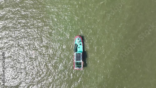 Aerial Perspective of Boat Navigating Through Tranquil Water Body