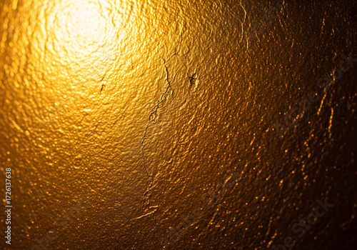 Shimmering Gold Texture: A close-up view revealing a textured, gold surface with subtle patterns and light reflections, evoking a sense of luxury and opulence.