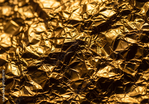 Golden Foil: A detailed shot of crumpled gold foil reflecting light, offering a rich textural and visual experience. 
