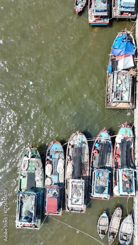 Aerial Perspective of Colorful Fishing Boats Docked at the Pier