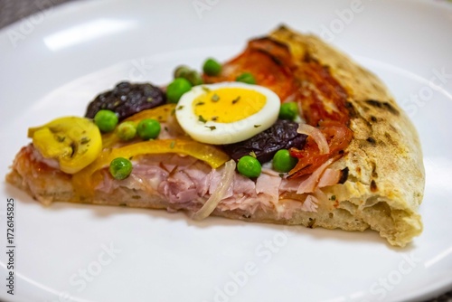 The most acclaimed, traditional and popular Brazilian pizza, half pepperoni calabresa and half Portuguese