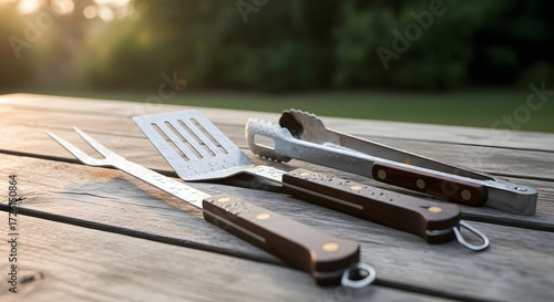 Wallpaper Mural Grill Utensils on Wooden Table in Nature Setting, Capture of BBQ Essentials at Sunset Torontodigital.ca