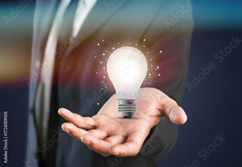 hand holding light bulb