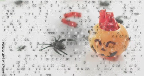 Binary code appearing and drifting over pumpkin and spider, flooding frame to show data intrusion