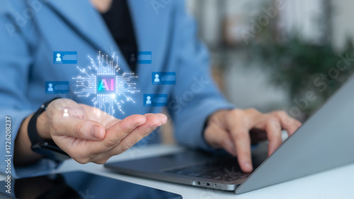 Photos Businessman hand holding AI icon with digital human profiles, artificial intelligence recruitment, HR technology, talent acquisition, candidate searching, and personnel management concept