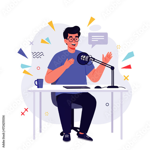 A man with glasses sits at a desk recording a podcast with a microphone, tablet, and coffee mug, gesturing with his hands.