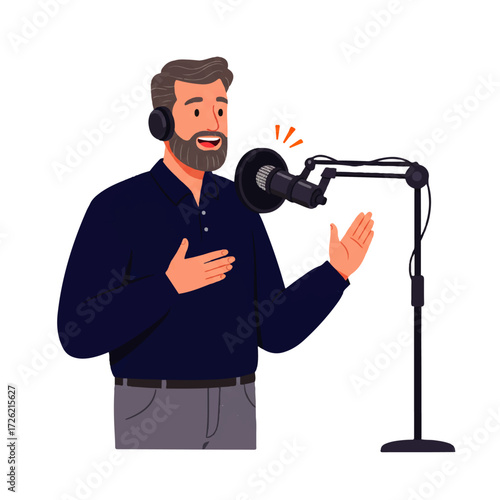 Man with beard and headphones speaking into a microphone on a stand, gesturing with his hand.