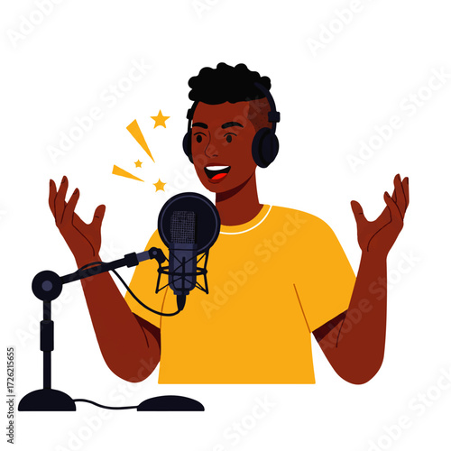 A young man with headphones enthusiastically speaks into a microphone during a podcast recording, gesturing with his hands.