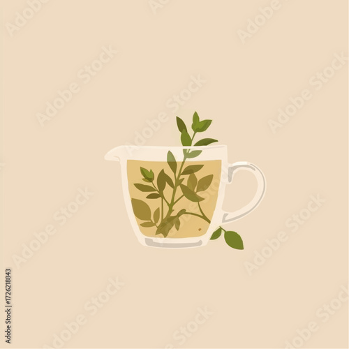 Herbal tea in a glass pitcher with fresh leaves on a soft background