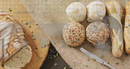 At start camera panning zooming out over bread assortment revealing sliced loaf for bakery display
