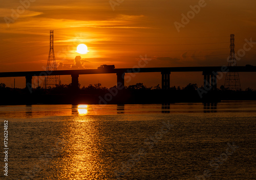 Orange Sunset Over silhouetted Bridge and Cape Fear River