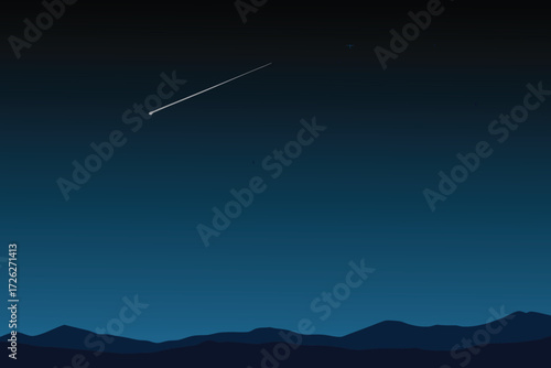 Dark night sky showing a shooting star and distant mountain range