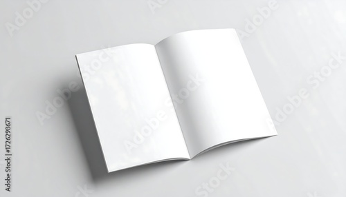 Open blank brochure on a light surface