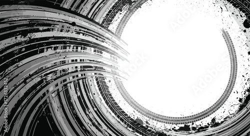 Abstract black and white swirling vortex with a bright central light source.