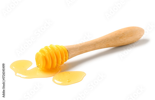 Obraz na plátně Dipper with spilled tasty honey isolated on white background