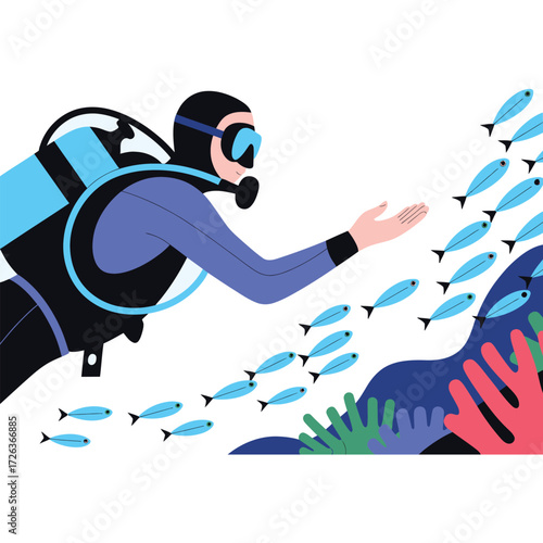 Scuba diver interacting with a school of small blue fish