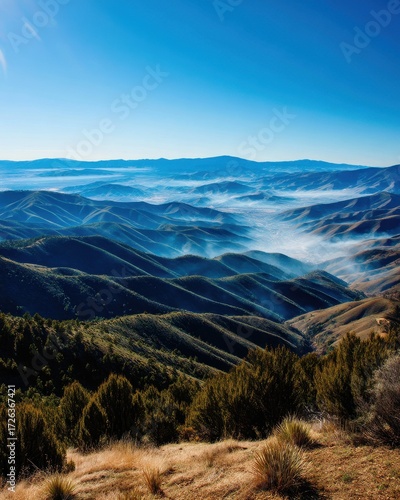 Misty Mountain Landscape at Sunrise Rolling Hills and Blue Sky