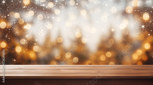 Empty wooden table top with warm golden bokeh lights and soft sparkling particles in festive holiday atmosphere, Concept of Christmas, New Year celebration and seasonal decoration.