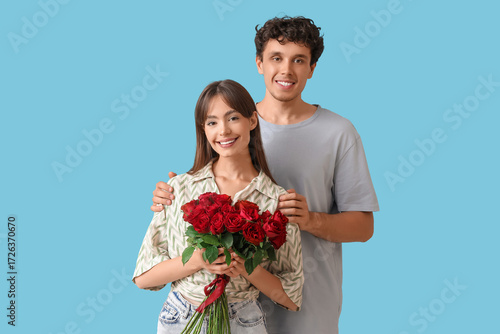 Young couple with red roses...