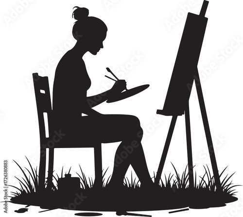 Black silhouette of woman painting on easel in grass