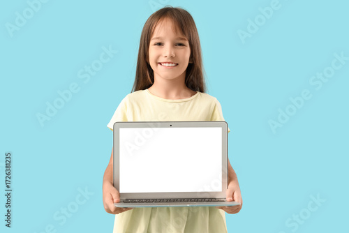 Cute little schoolgirl with...