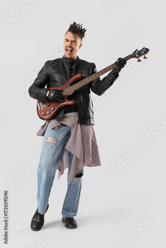 Energetic male bass guitari...