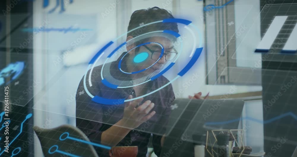 Engineer using stylus, tapping laptop screen, animating holographic UI ...