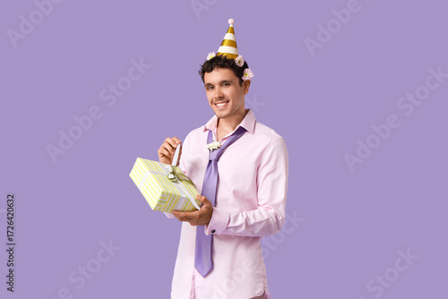 Happy young man with Birthd...